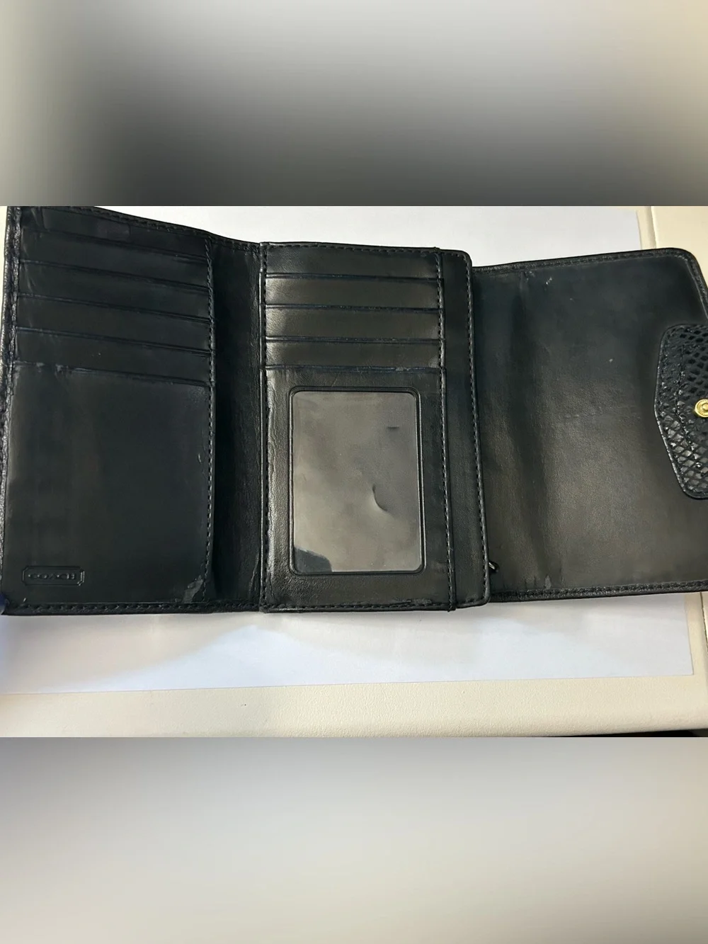 Coach Women’s Black Tri-Fold Wallet with Gold Script Logo